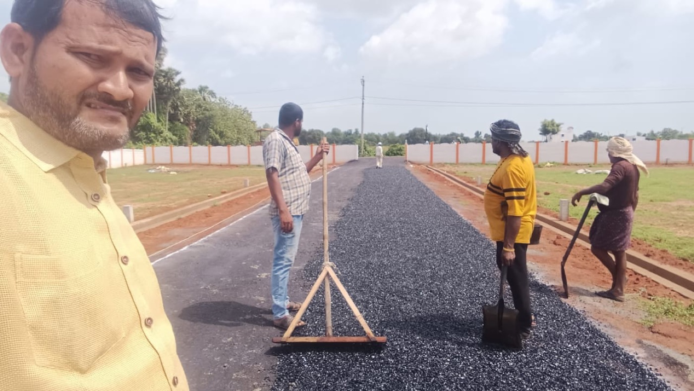 Wide internal road and demarcated plots at the Adhvik Aero City venture